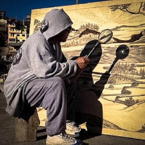 Artista faz inacreditáveis arte usando uma lente de aumento solar 
