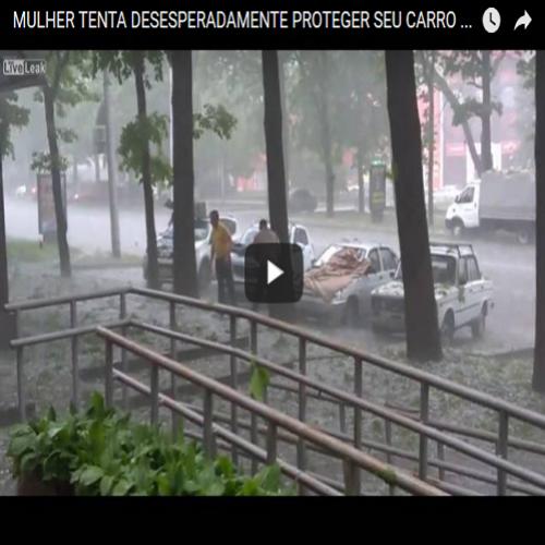Mulher tenta desesperadamente proteger seu carro da chuva de granizo