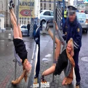 Ex-mulher de cantor russo faz pole dance em poste para policiais...